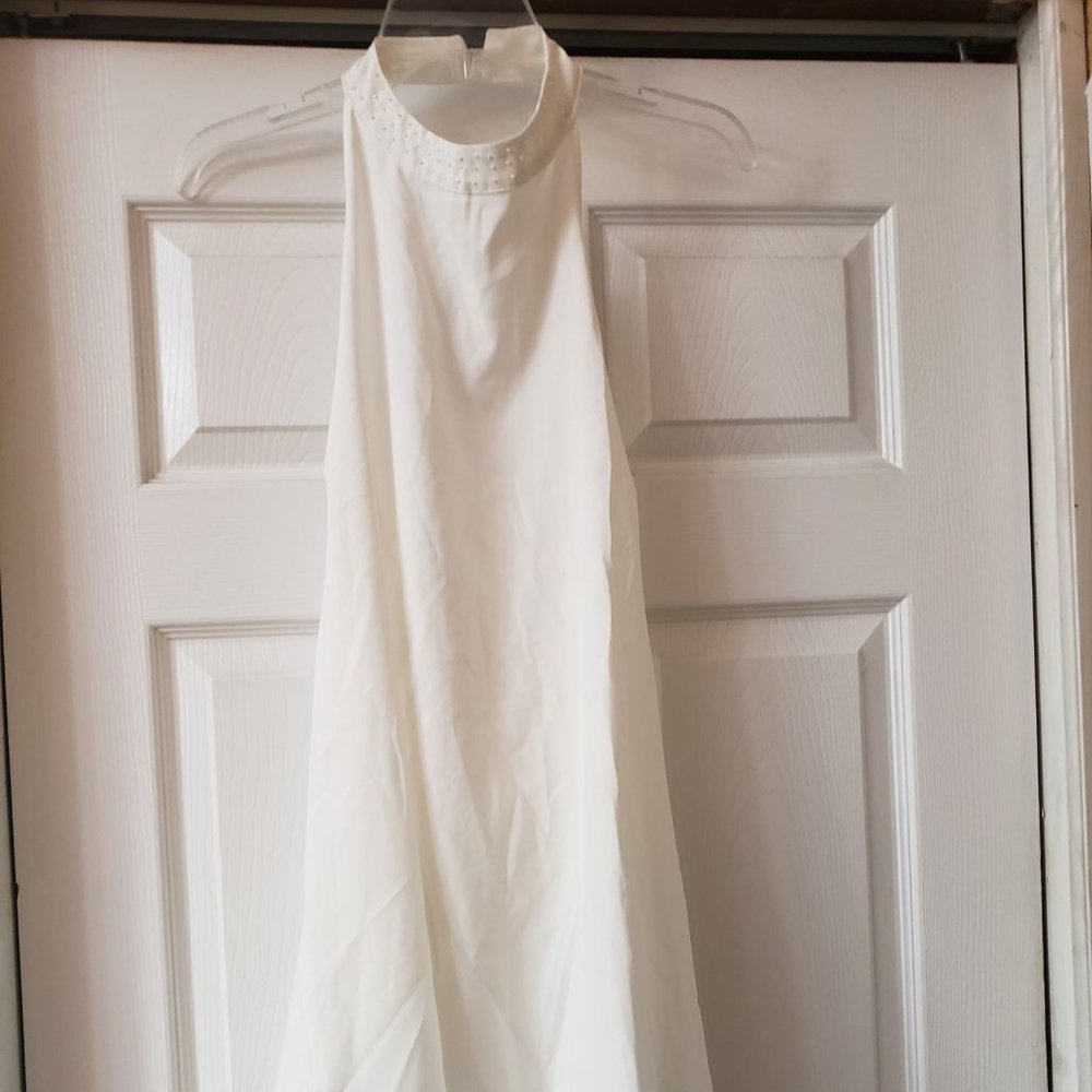 White dress with pearl detail on the neck